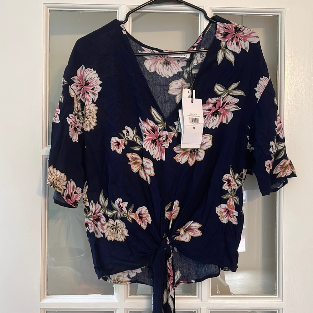 Never-worn Luq brand navy shirt with floral design.